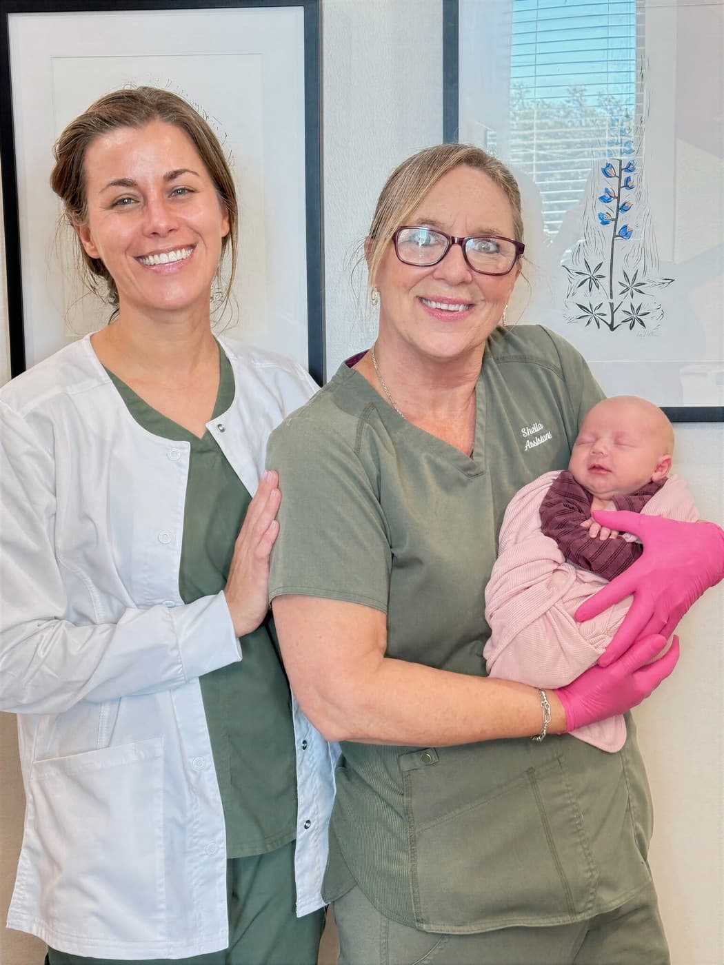 Dr. Kacie Culotta and a team member caring for a newborn at Latched Beginnings